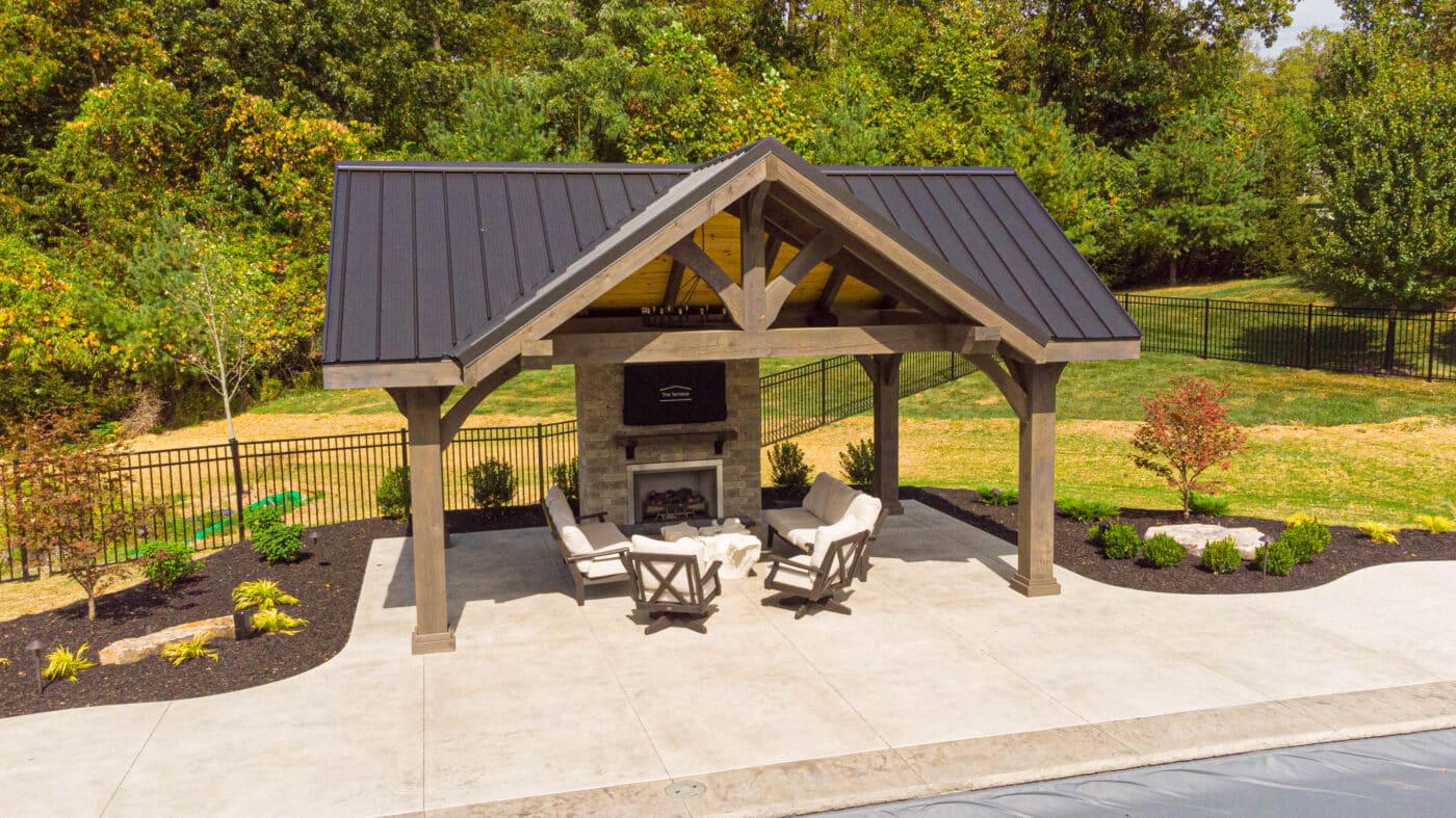 deluxe pavilion with a fireplace and seats underneath in Seneca, PA