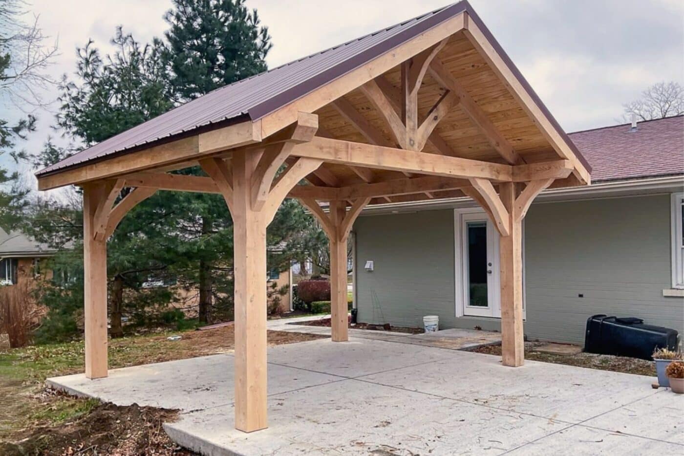 Timber Frame Pavilions in Grove City, with red metal 