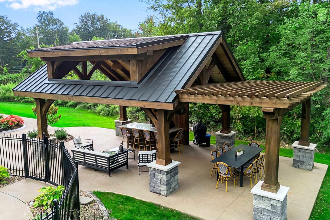 custom backyard pavilion with an attached pergola