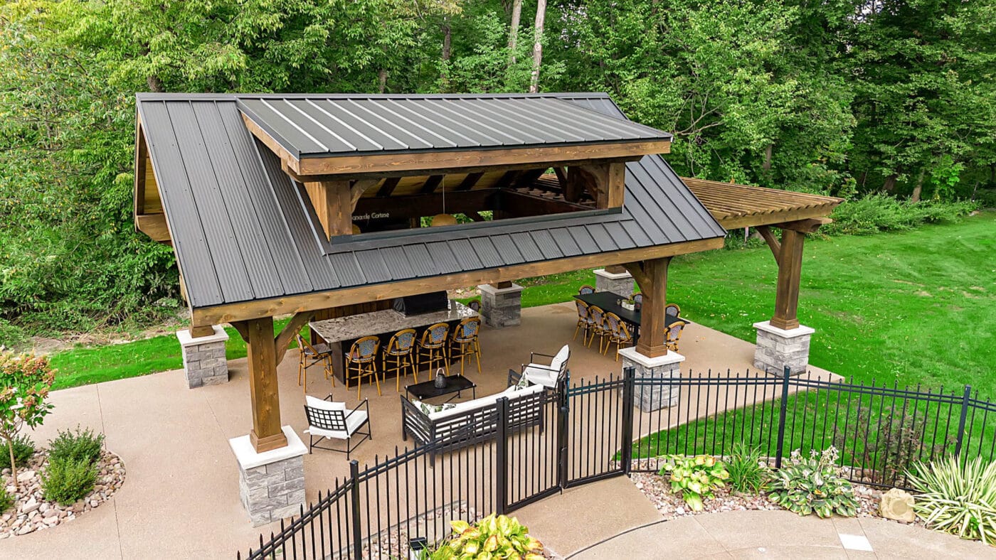 lakeside luxe timber frame pavilions in mars PA in the backyard with a fence