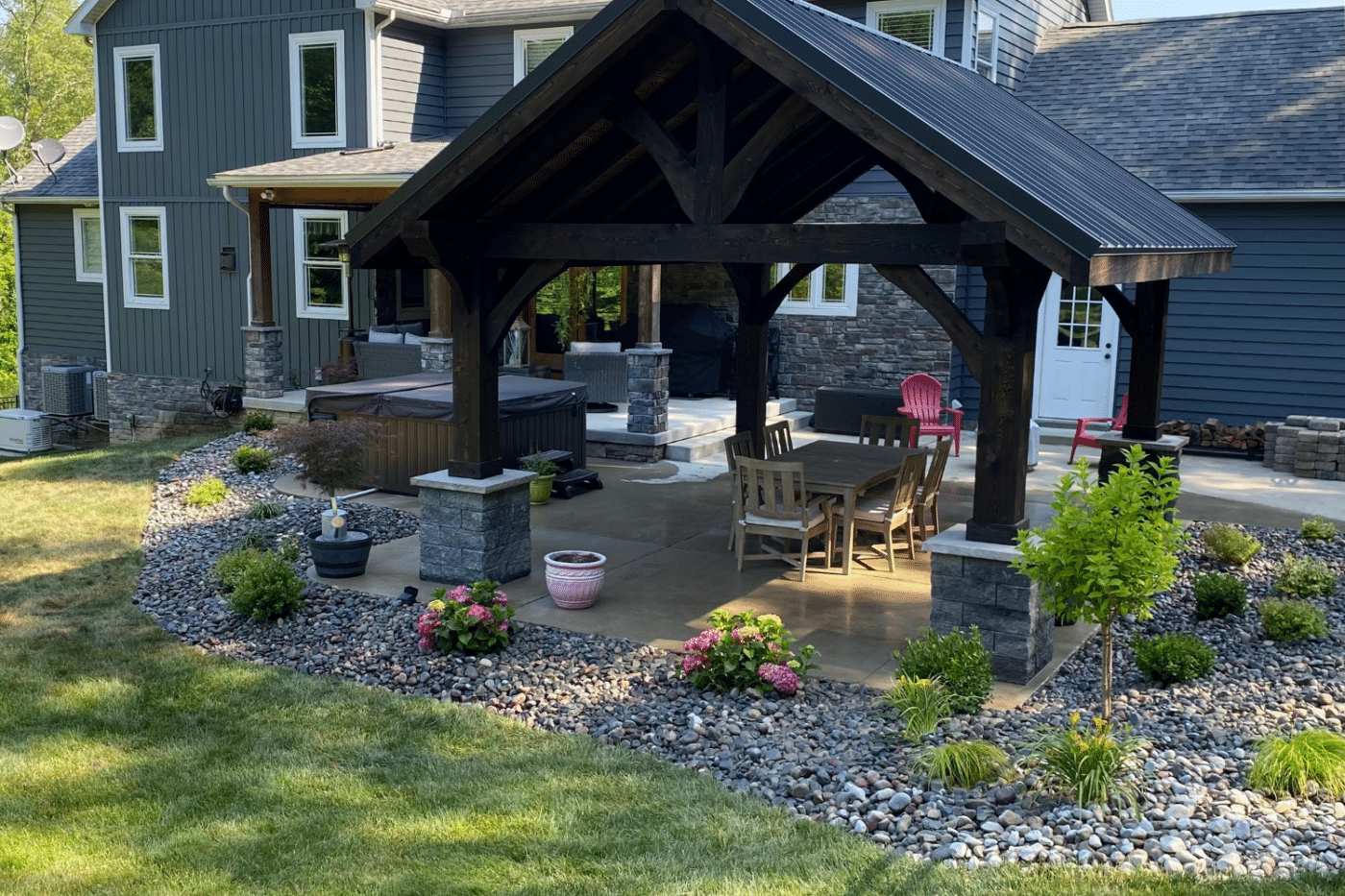 Pavilion with plants surrounding and hot tub