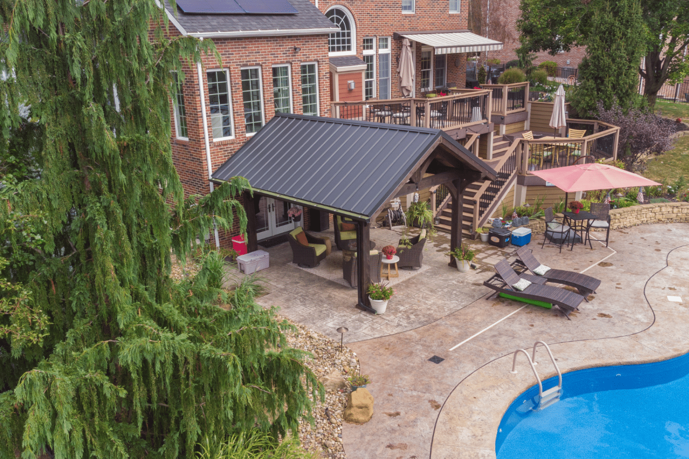 Poolside pavilion with sitting area underneath