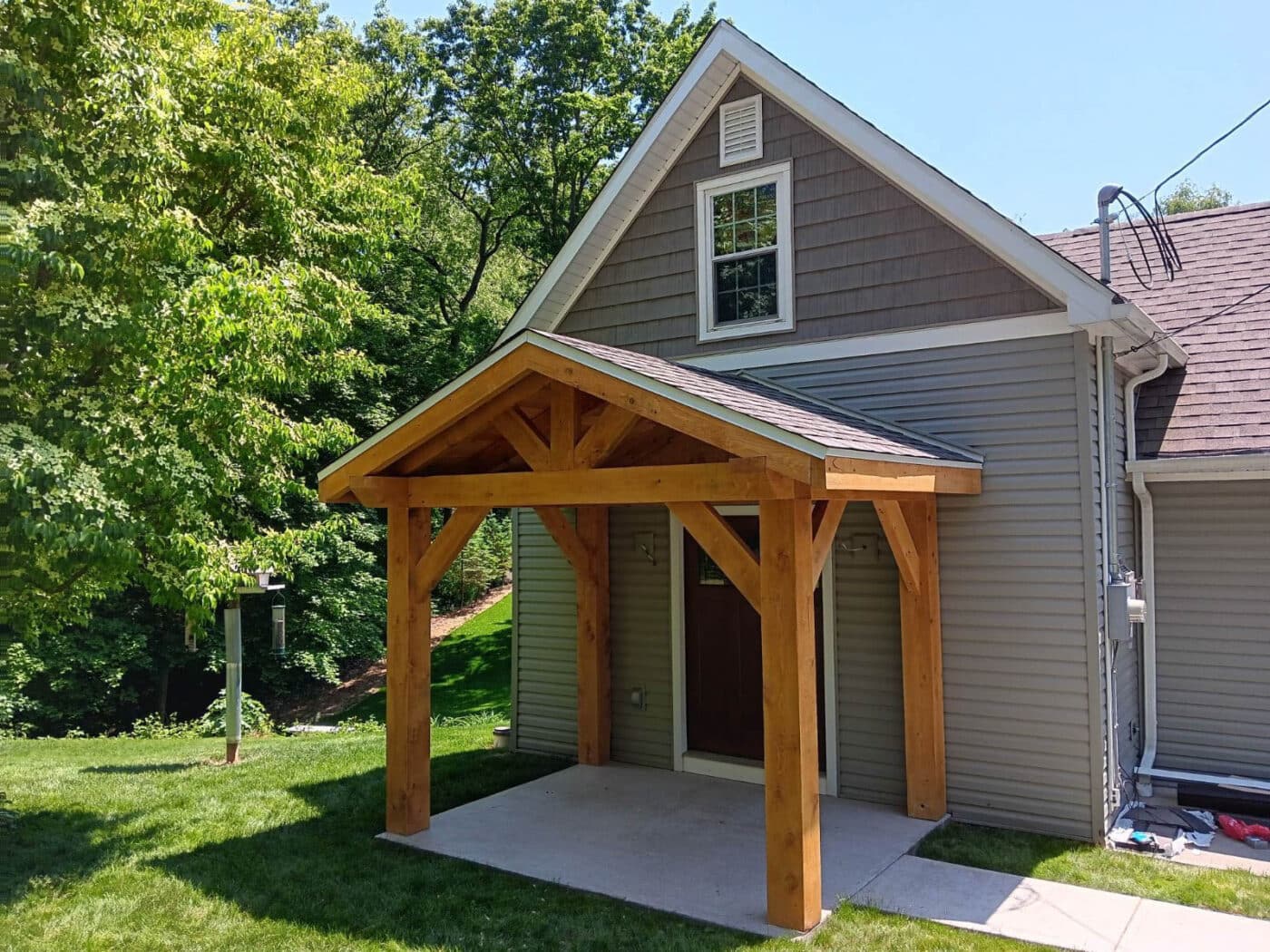 Home with a new timber frame porch attached in Wexford PA