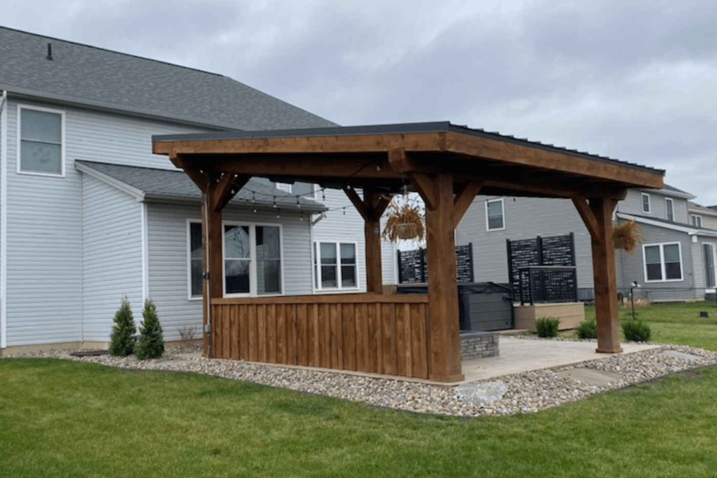 The Evergreen lean to pavilion in backyard